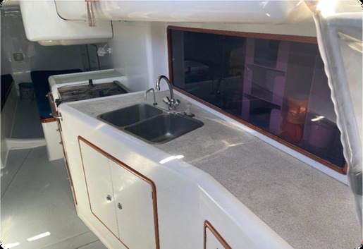 Galley with double sink, grey worktop and cupboards